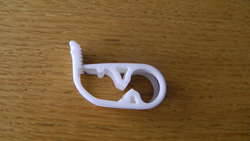 White plastic one pump tube clip